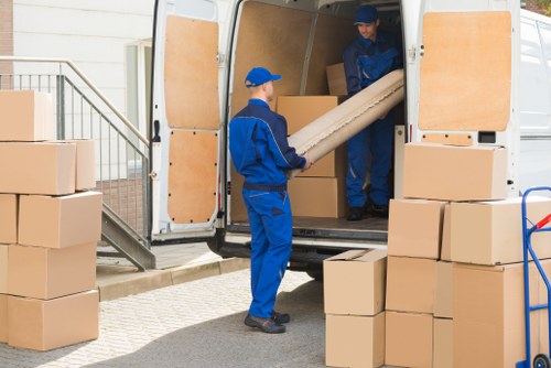 Professional movers handling boxes in East Ham