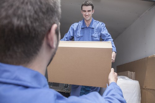 Professional movers handling furniture during a relocation