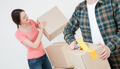 Professional movers handling household items in Streatham