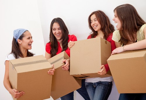 Removal team transporting furniture in Stoke Newington