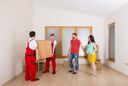 Loading items into moving truck in North Kensington