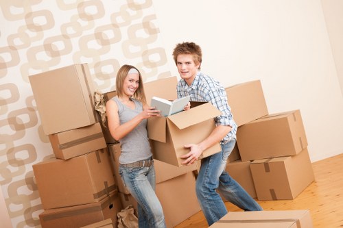 Individuals loading items into a moving truck